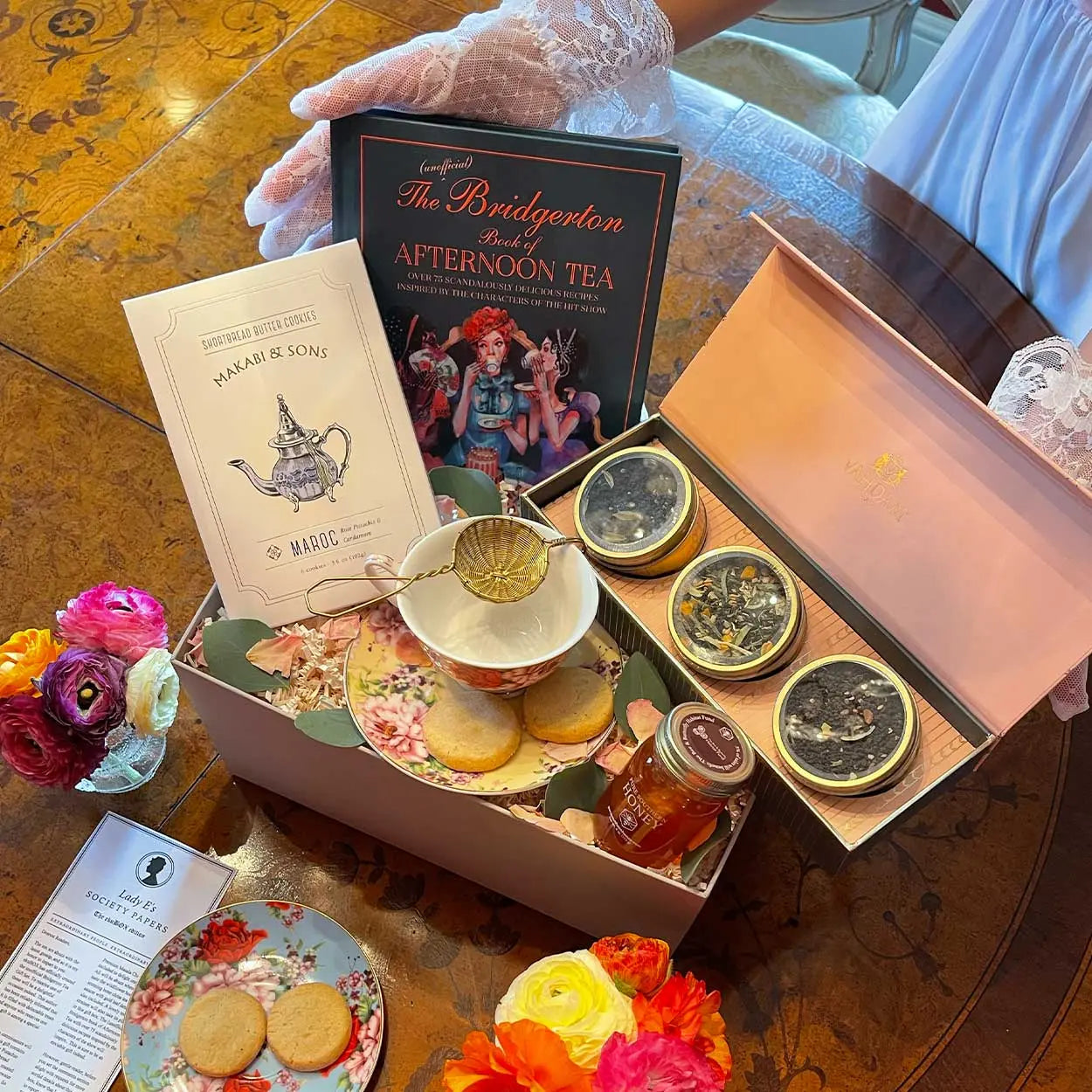 An elegant tea gift set with fine loose-leaf teas and a porcelain cup curated inside an ekuBOX luxury gift box for tea lovers