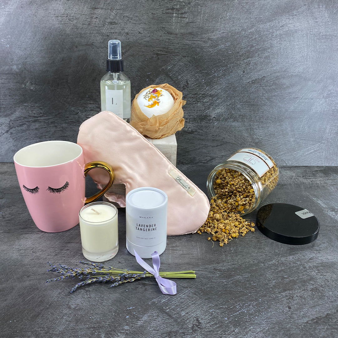 A serene bedroom scene with soft lighting and cozy bedding — illustrating the science of sleep and ekuBOX’s curated sleep gift box