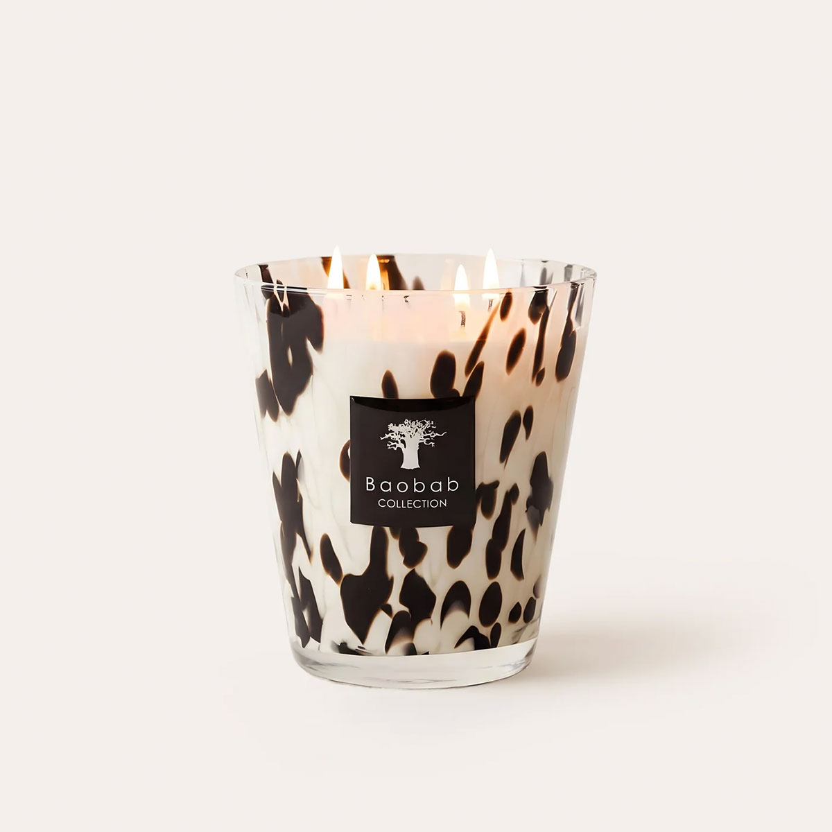 Baobab Signature size Pearls Black candle in black and white handblown glass on a white background.