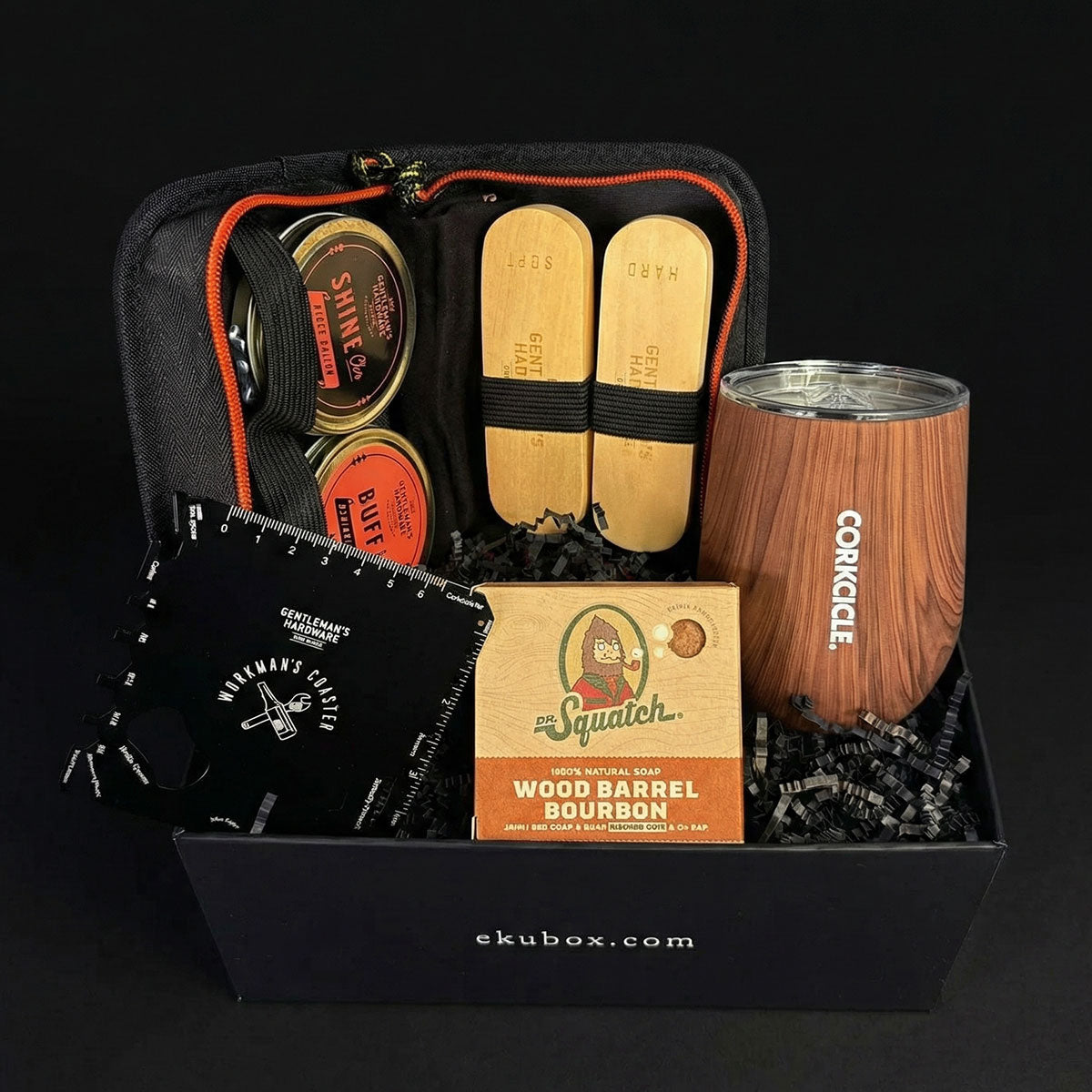 men's grooming gift set essentials, a shoe shine kit, a wood grain stemless cup, and a 20-1 multi-tool coaster and bar soap.
