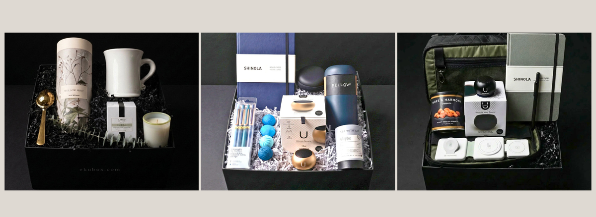 Luxury corporate employee onboarding gift boxes displayed open, hand-adorned in the ekuBOX studio with premium curated contents, dried botanicals, and handwritten notes β ready to ship for HR teams