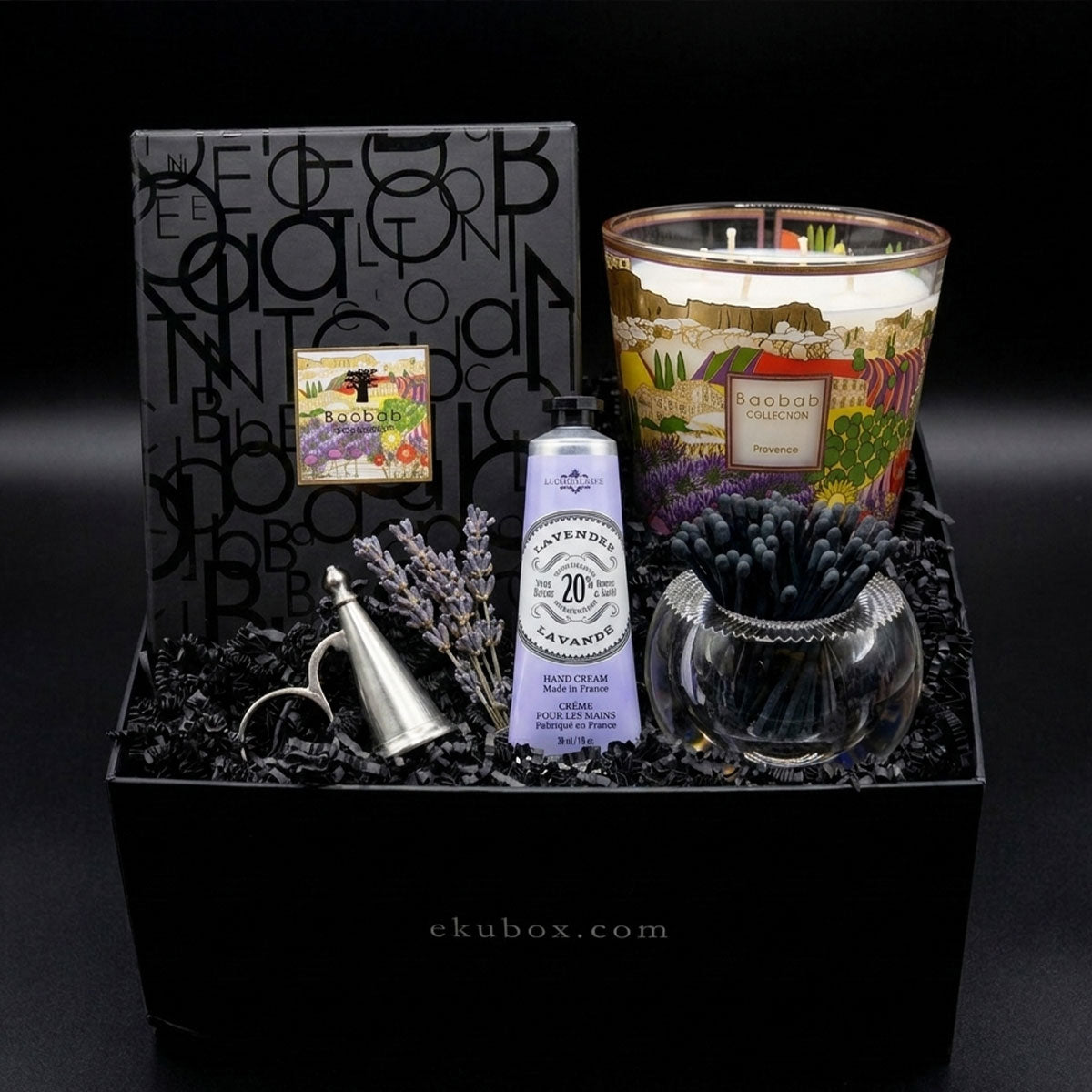 Baobab Gift set with Provence candle, hand cream, Match Pewter snuffer and an acrylic match holder in a black box on a dark background