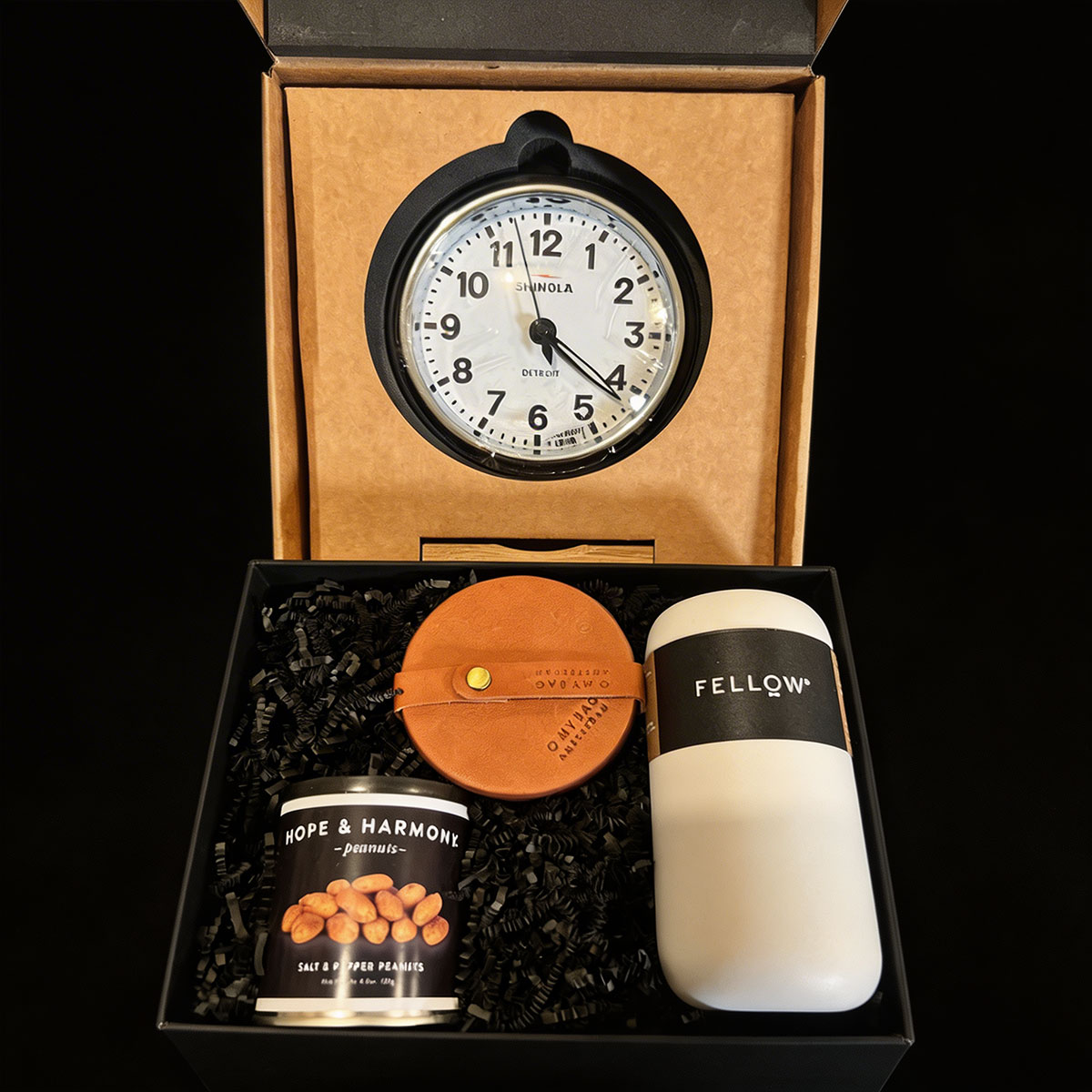 Gift set with Shinola clock, Fellow coffee container, leather coaster set, and Hope & Harmony peanuts in a 2 boxes for shipping.