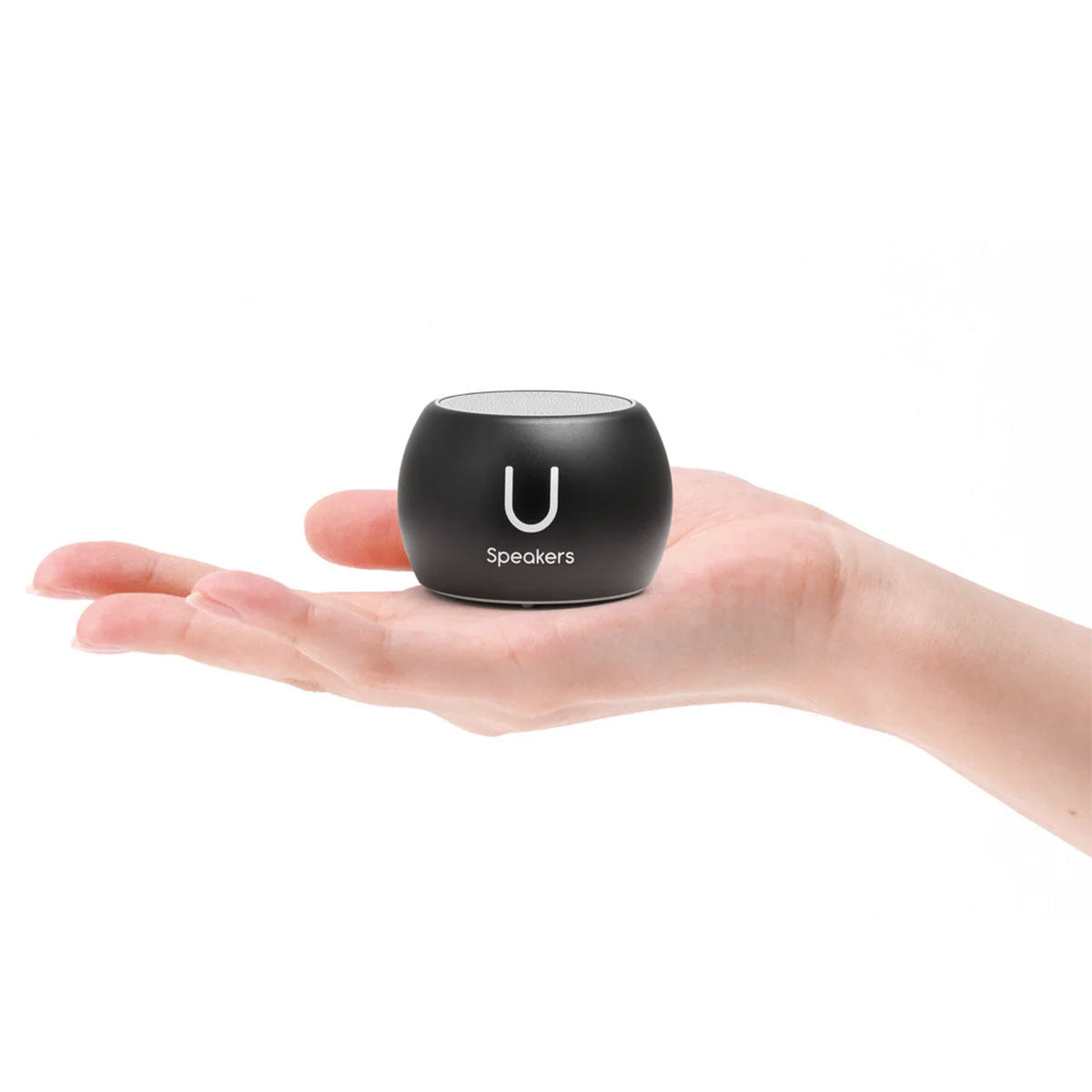 Black portable U speaker mini held in a hand on a white background