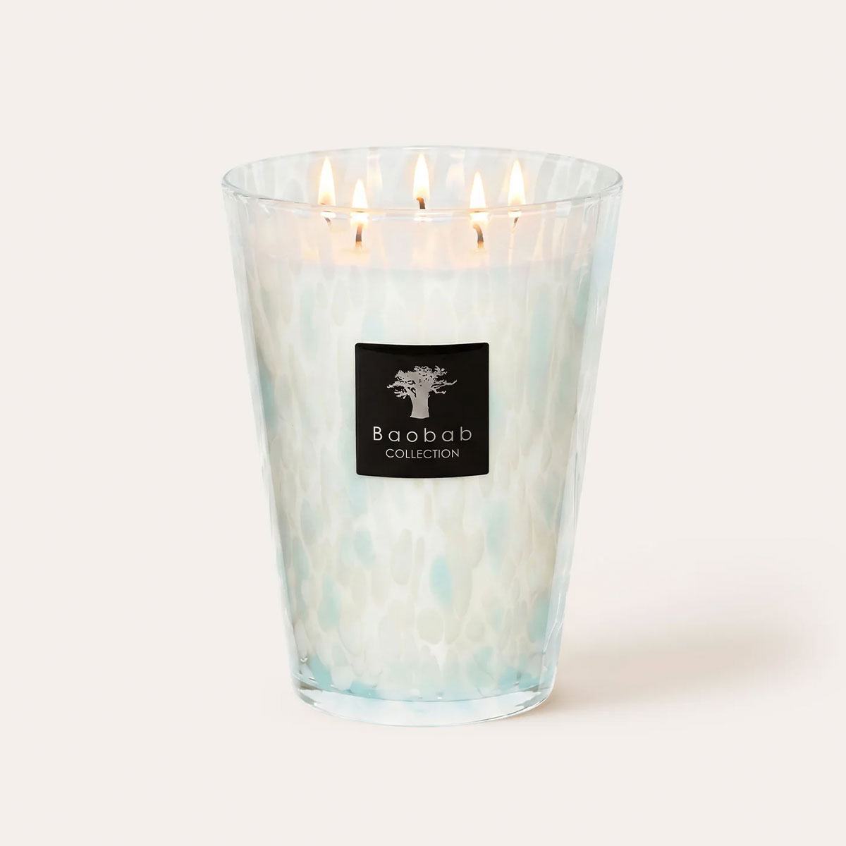Baobab Sapphire Pearls Grande Candle a clear and aqua glass vessel candle on a white background.