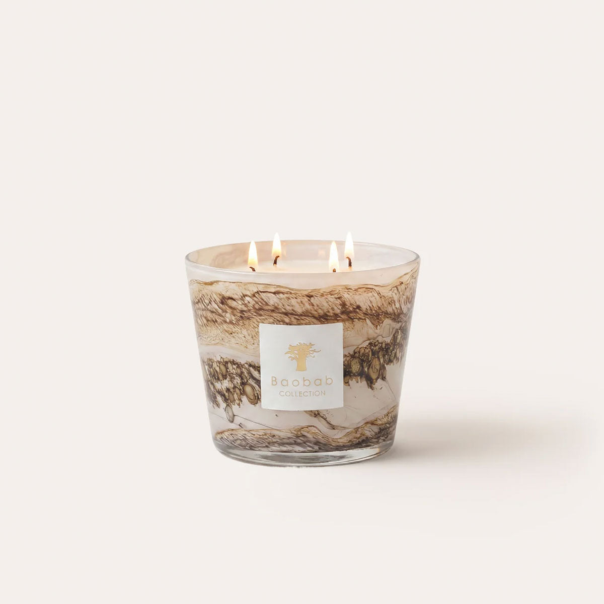 Baobab Siloli candle in hand-blown beige and brown glass with organic patterning and a warm decorative appearance.