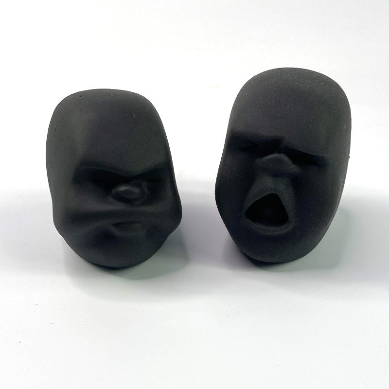 face stress balls in black on a white background