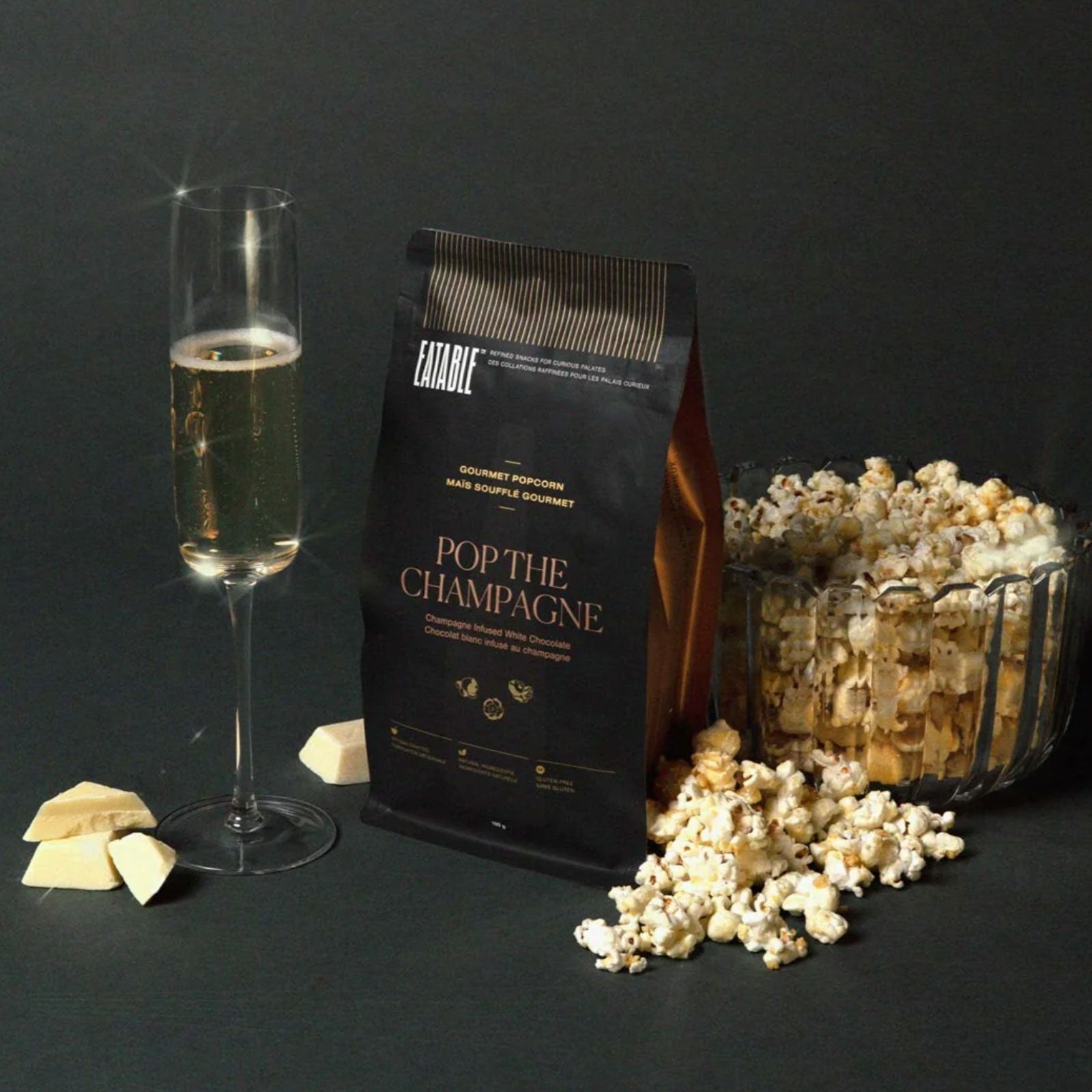 pop the champagne popcorn bag and a bowl of popcorn and glass of champagne