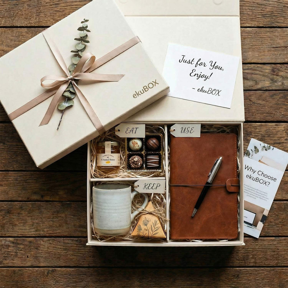 Luxury Gift box with a notebook, pen, and candies representing something to eat, keep and use gifts.