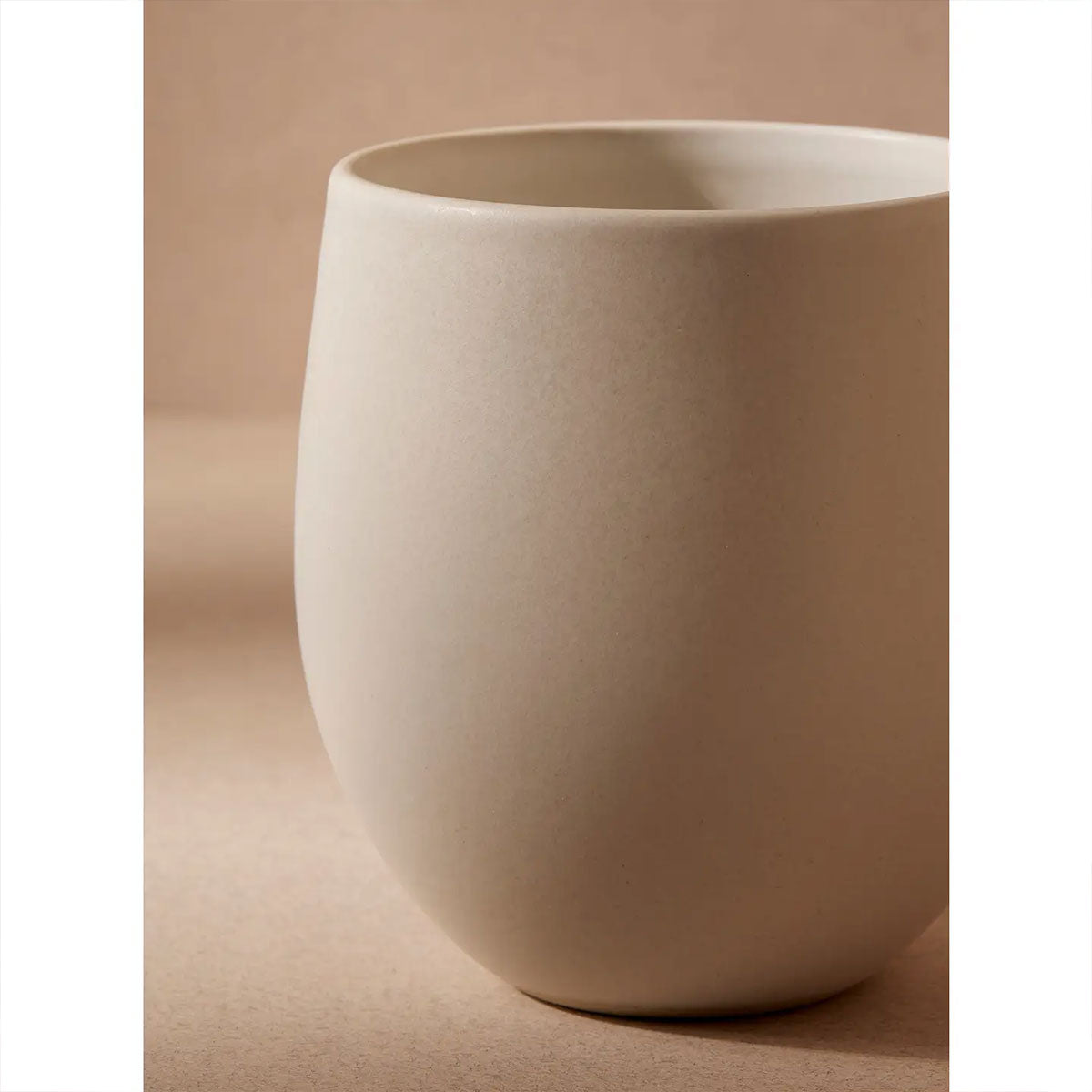 ceramic cup on a beige background