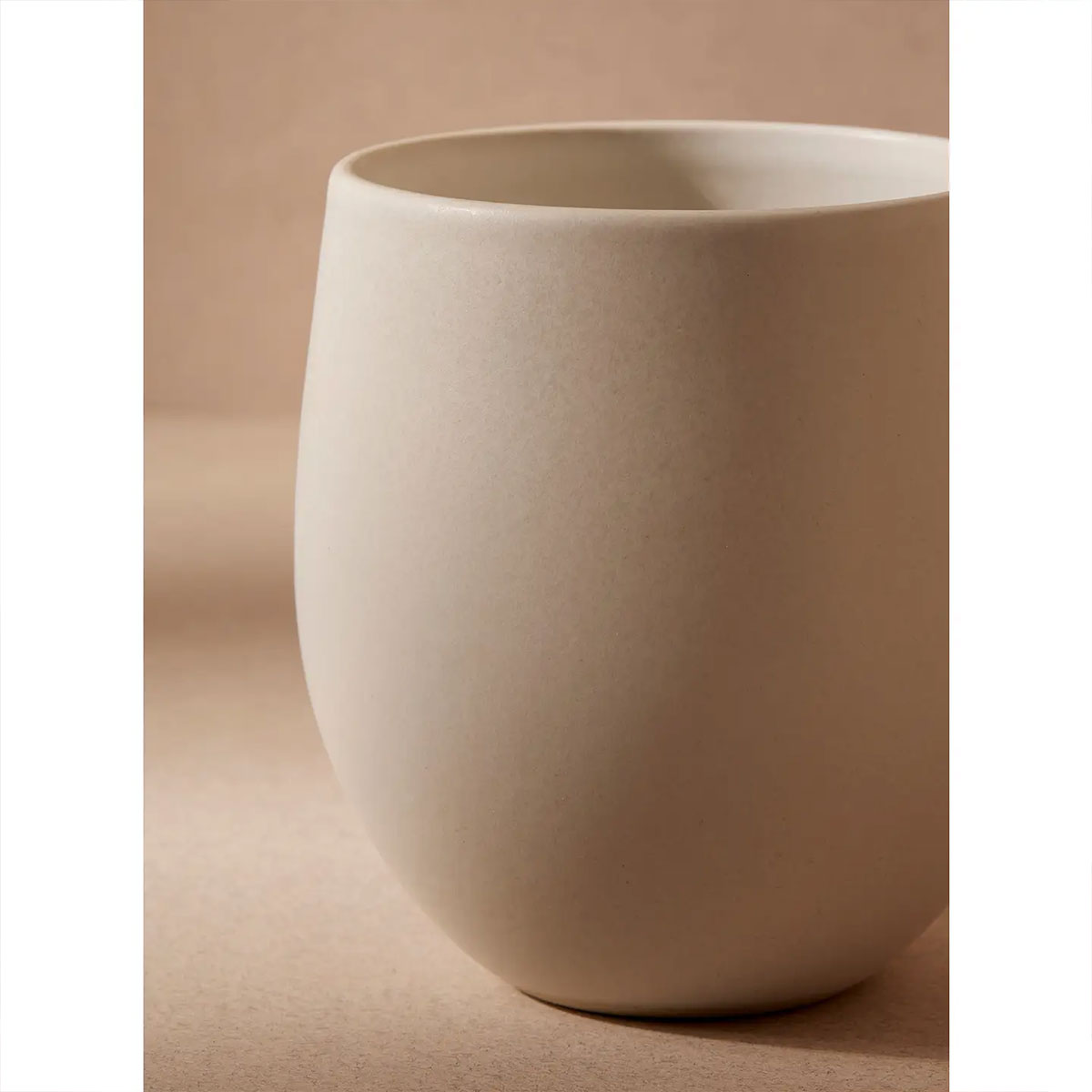 ceramic cup on a beige background