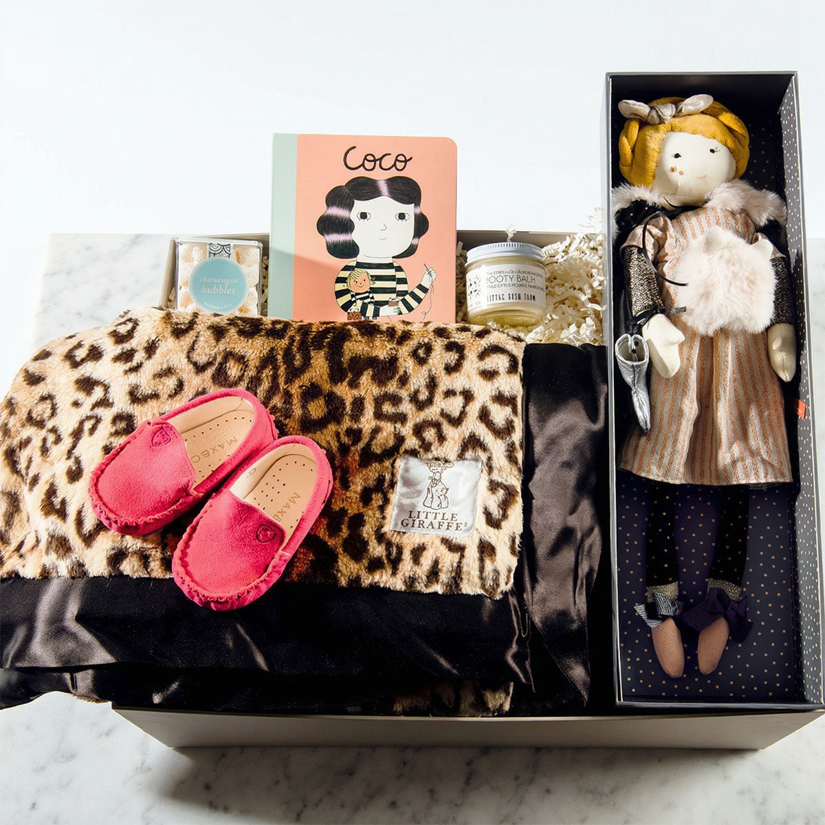 Bougie Baby curated newborn baby gift box with little giraffe blanket- and french doll, book, pink suede shoes