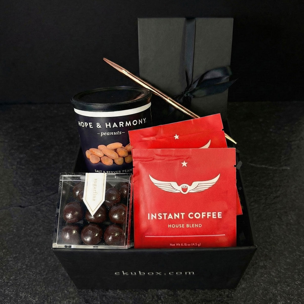 mini moment gift box instant coffee packets, peanuts, pen, notebook and caramel chocolate balls