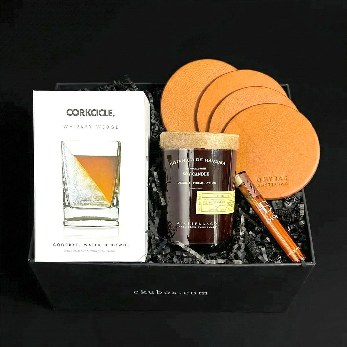refined tastes gift set with corkcicle whiskey wedge glass along with leather coasters and toothpicks