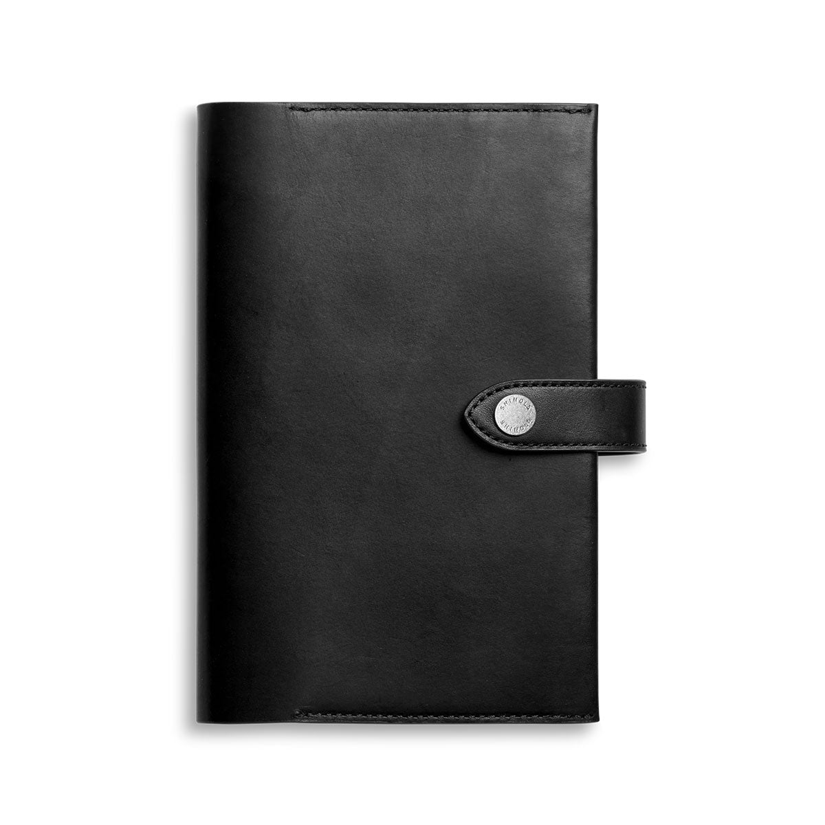 Shinola Black leather notebook cover with a silver buckle on a white background