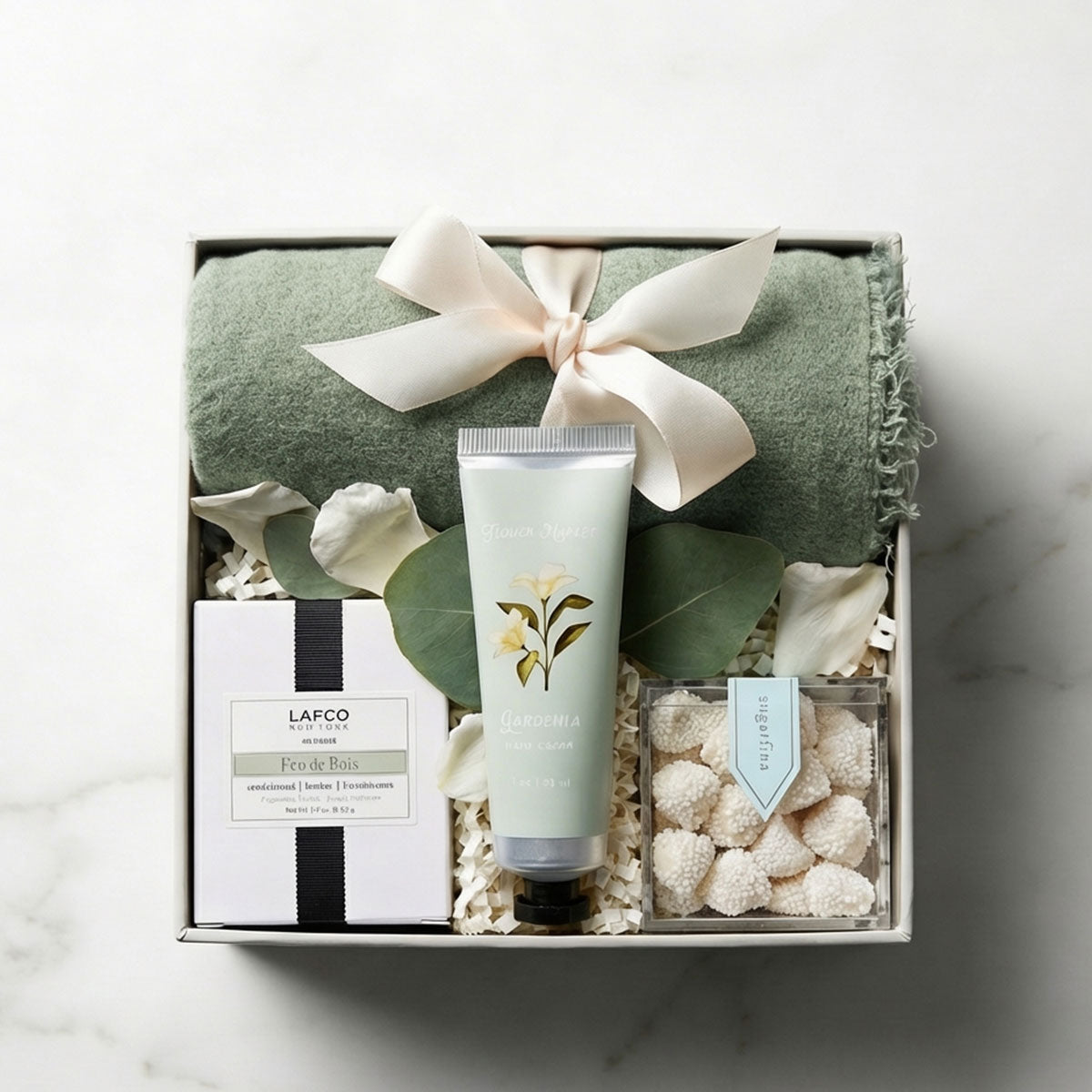 gift set with boho scarf, lafco votive candle, sugarfina candy in a gift box