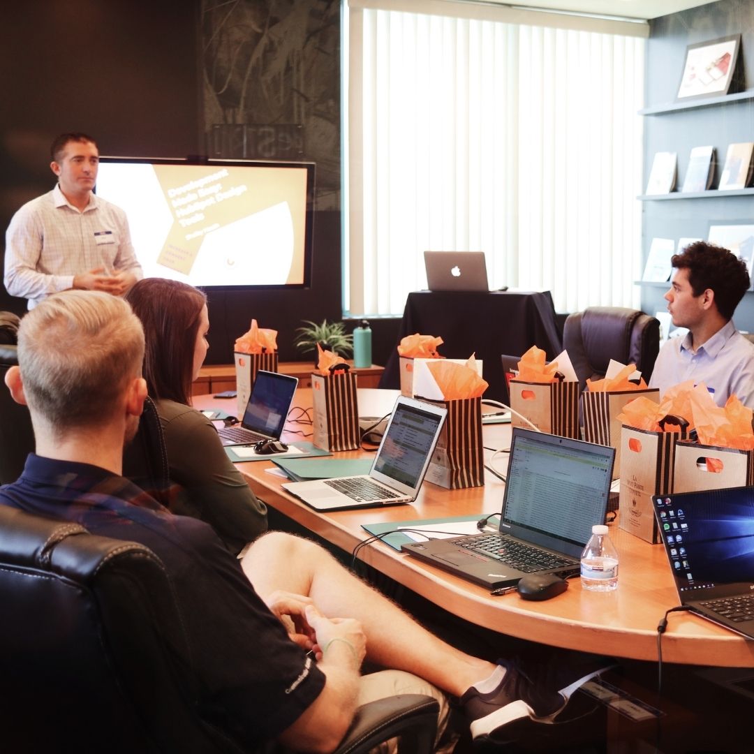 A team celebrating employee appreciation with a curated ekuBOX gift — luxury employee appreciation gifts that drive business growth