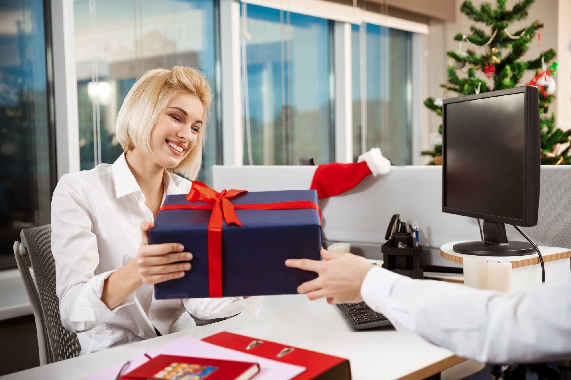 A corporate team reviewing gifting strategy with ekuBOX luxury gift boxes — how strategic gifting fuels business growth and client retention
