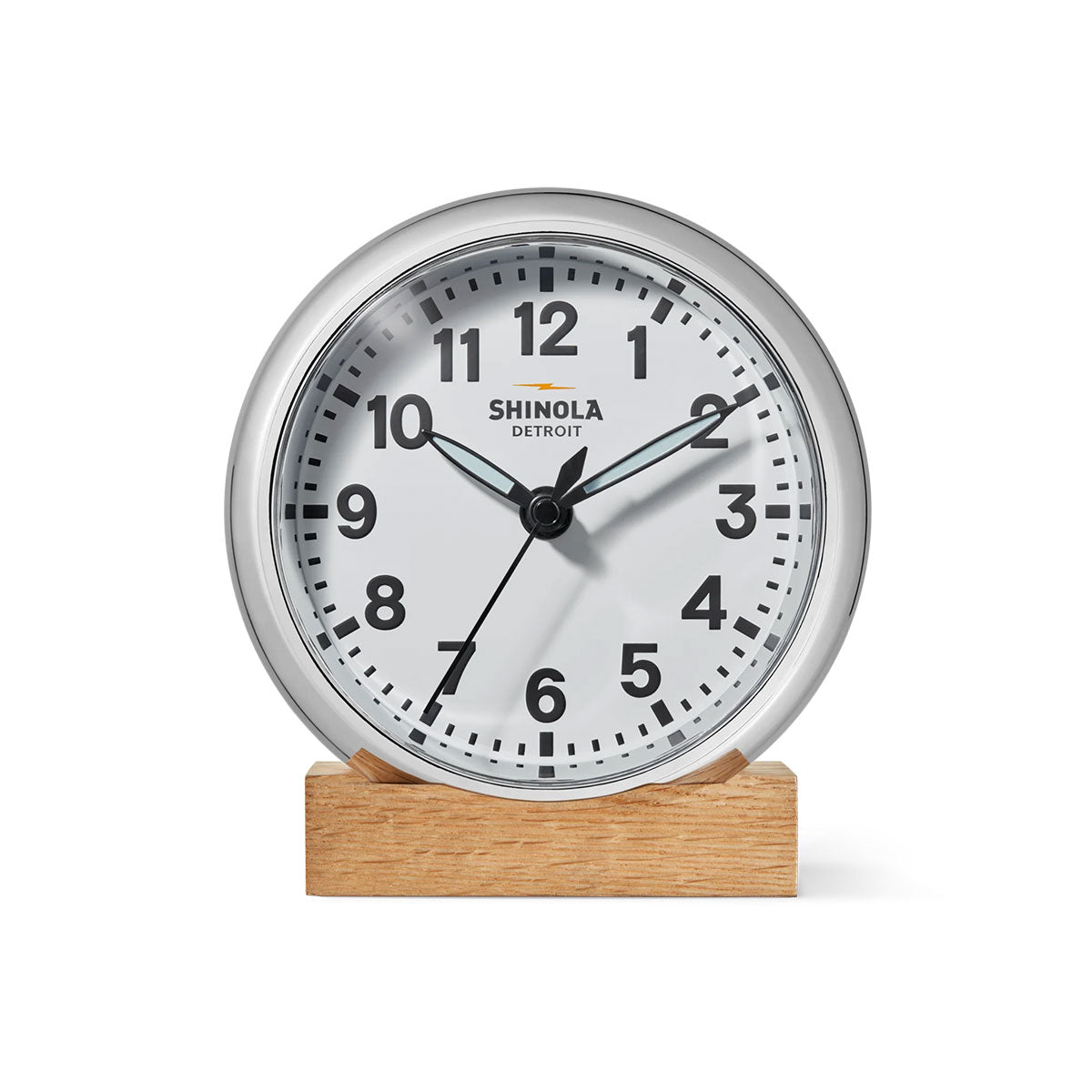 Shinola Runwell clock with a white face and a wooden base on a white background