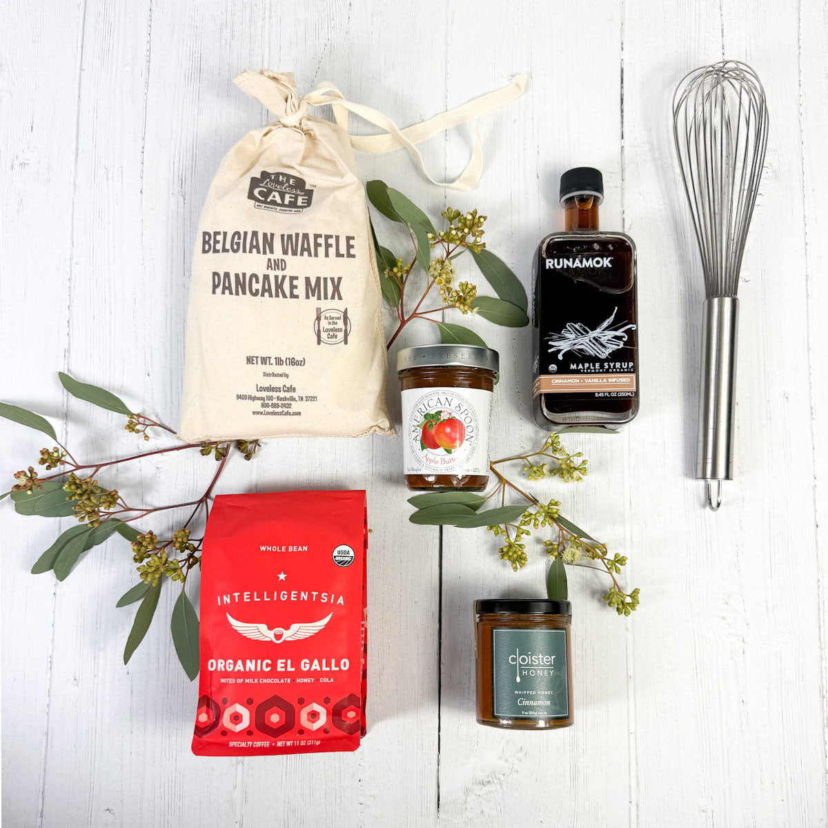 lay down of the breakfast Club gift set pancake mix, jam, maple syrup, whisk, coffee and honey