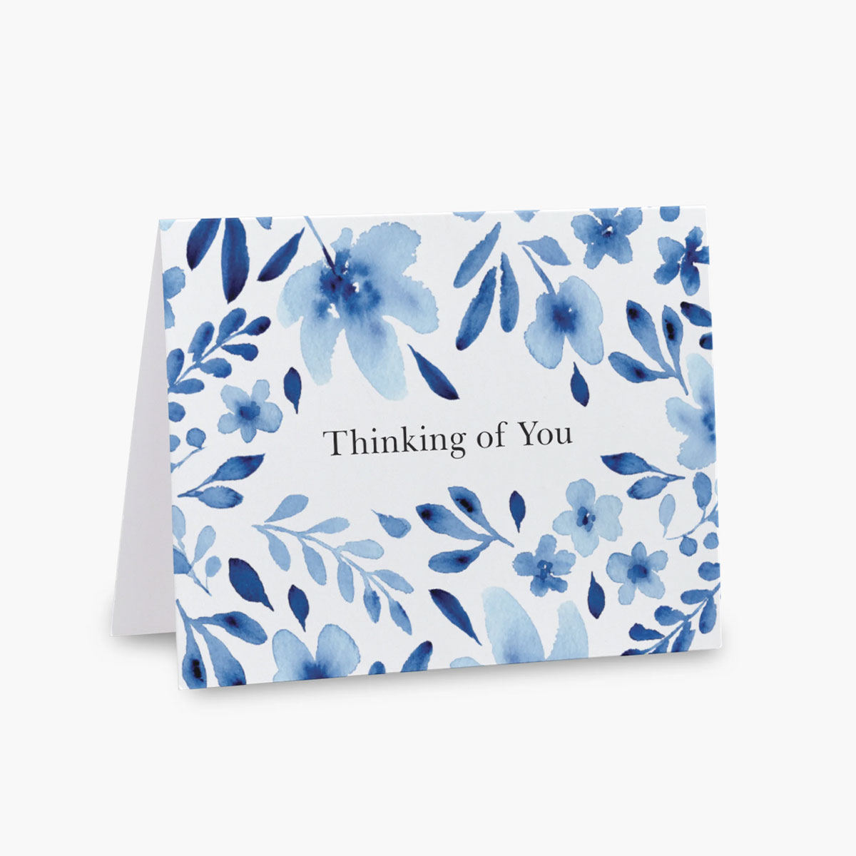 white card with thinking of you surrounded by blue forget-me-not flowers
