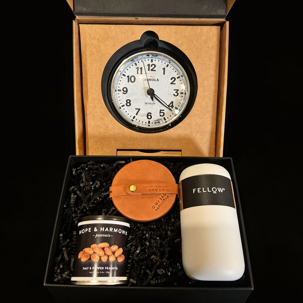 Gift set with Shinola clock, Fellow coffee container, leather coaster set, and Hope & Harmony peanuts in a 2 boxes for shipping.