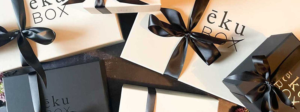 We pack our curated gift boxes in our signature packaging. Our beautiful boxes come in both black on black and grey with our black logo. They are embellished with satin ribbons and petite lavender bouquets when appropriate.