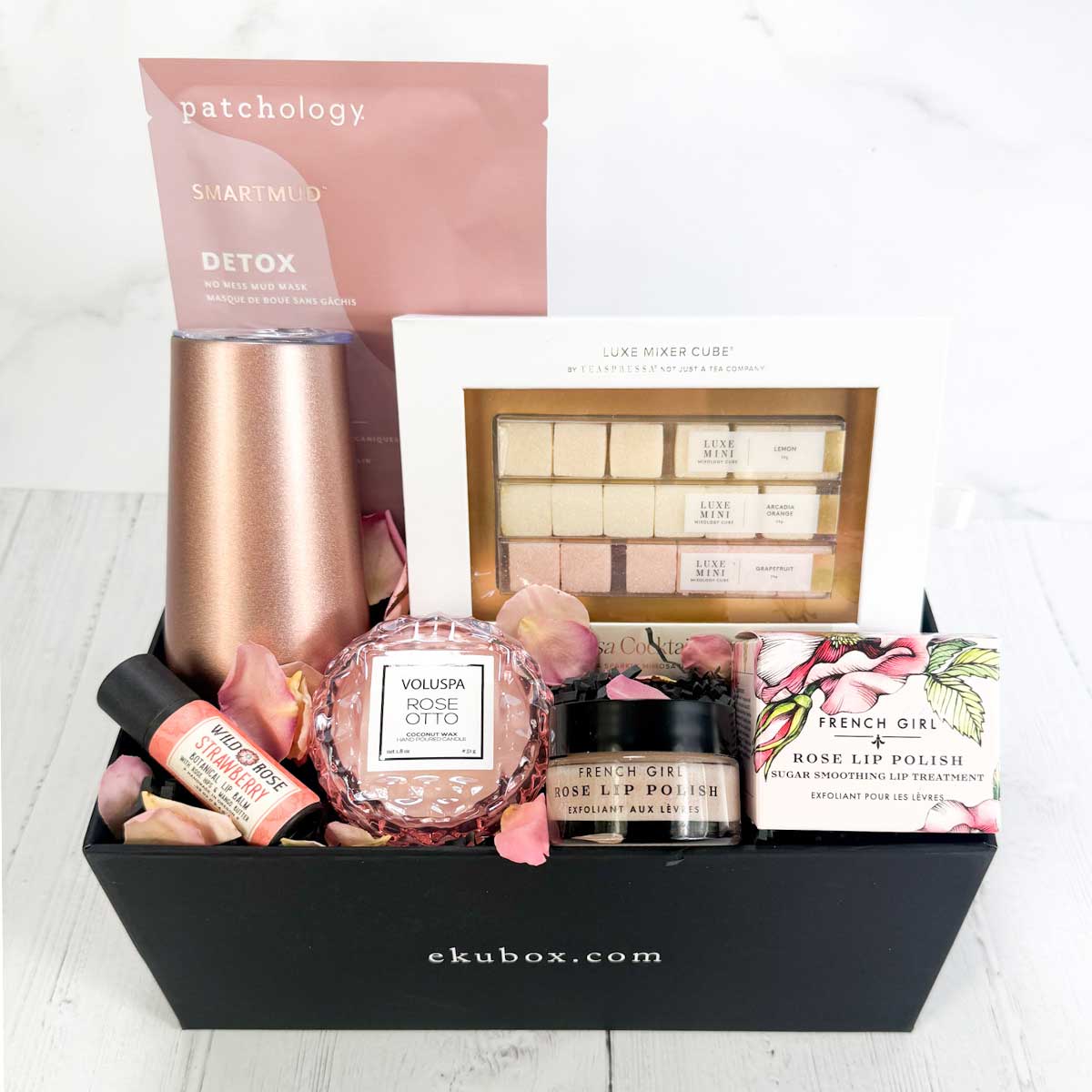 Bubble and Bliss spa gift box with Skincare and beauty products in a box, along with a mimosa kit and a stemless thermal champagne flute on a white background