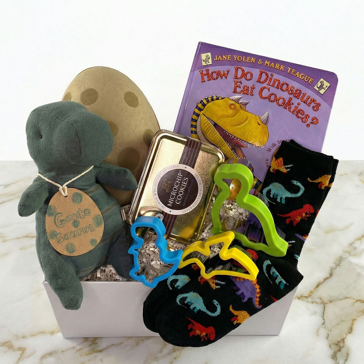 dino-Mite! A dinosaur themed kids gift. with maileg dino, socks, cookie cutters, cookie and book.