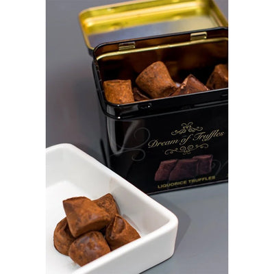 caramel sea salt truffles in a black tin labeled &