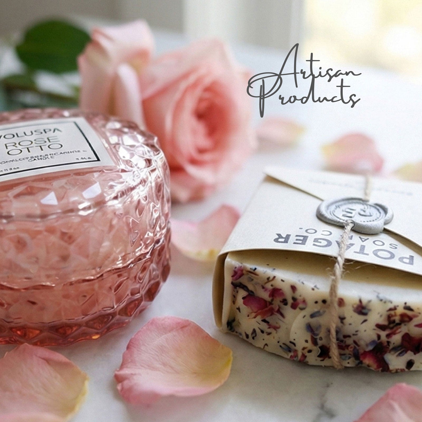 Luxury gifting voluspa rose candle, artisan soap surrounded with rosees form our ready-to-ship gifting service.