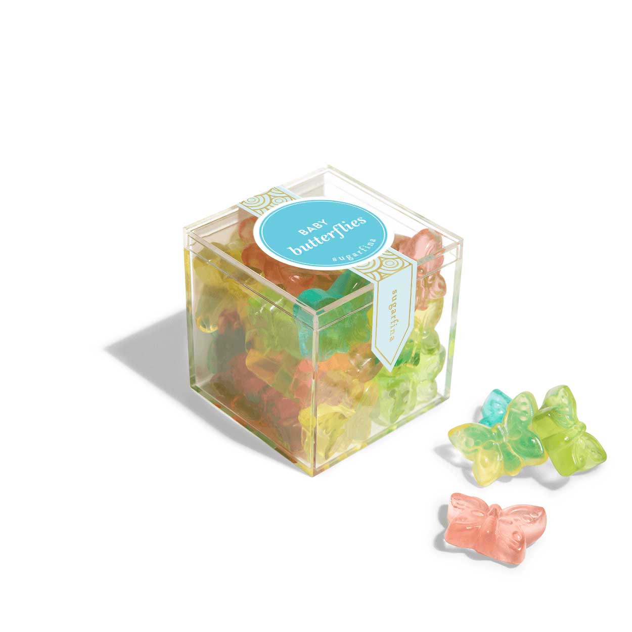 sugarfina baby butterflie candies in a transparent cube on white background