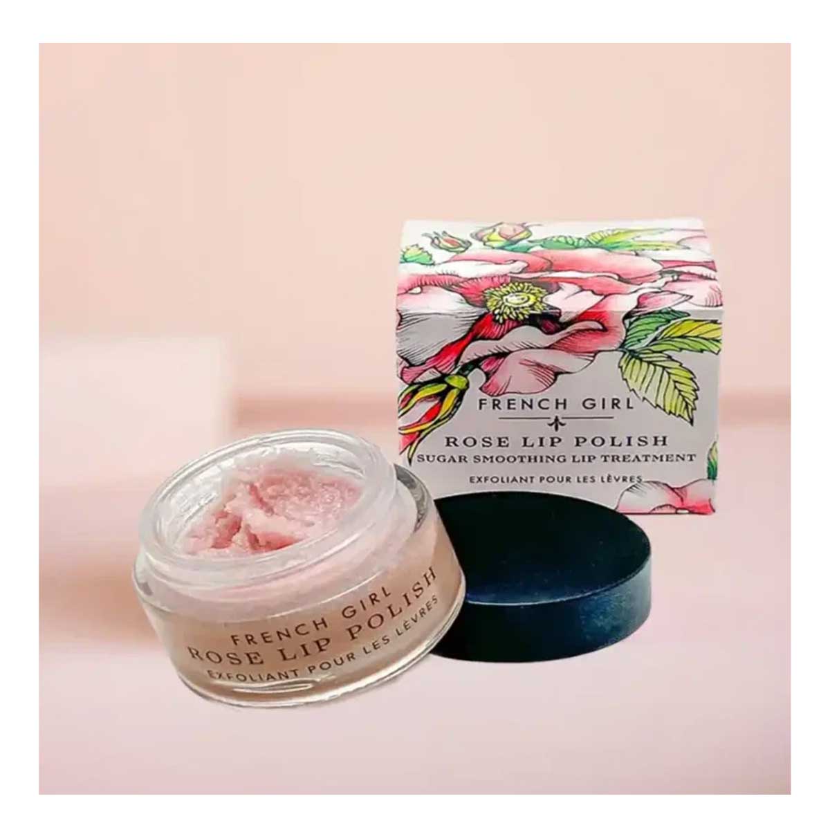 French Girl Organics Rose Lip Polish with packaging on a pink background
