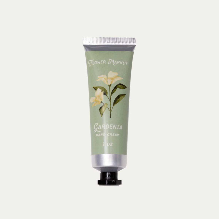 Gardenia Hand cream tube with floral design on a light gray background