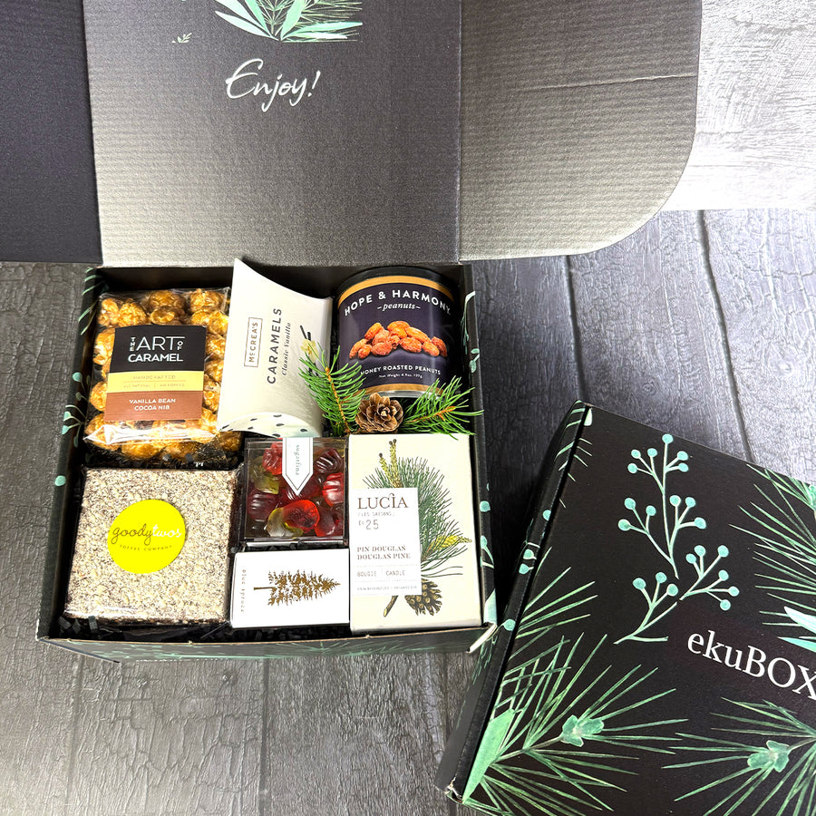 Open mailer gift box with gourmet snacks and in an &