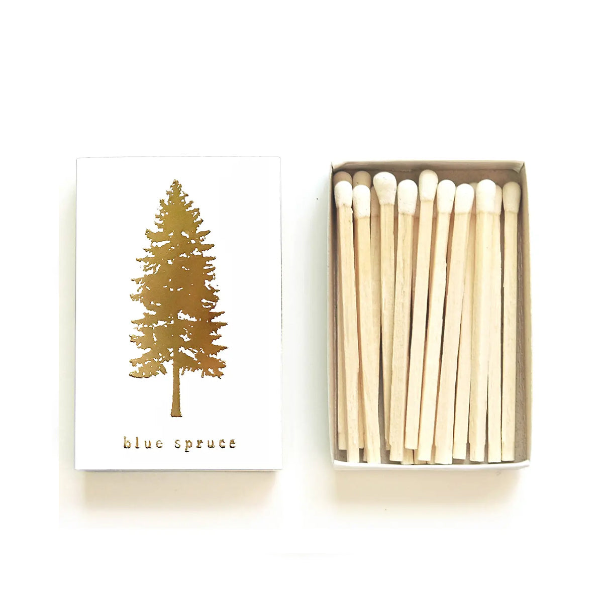 Matchbox with gold tree design and 'blue spruce' text on a white background
