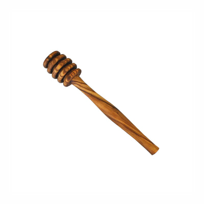 Wooden honey dipper on a white background