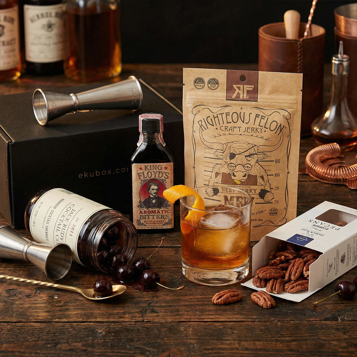 non-alcoholic - pecans, cherries, bitters, jigger and jerky gift. and glass on table