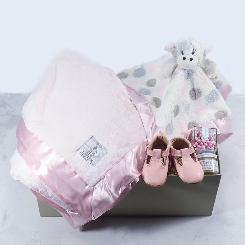Send a Luxe Baby Gift Set to the new parents. This beautiful gift box is filled Little Giraffe Lovey and luxe blanket along with leather baby shoes and more. Send a little Giraffe gift set to welcome the new baby.
