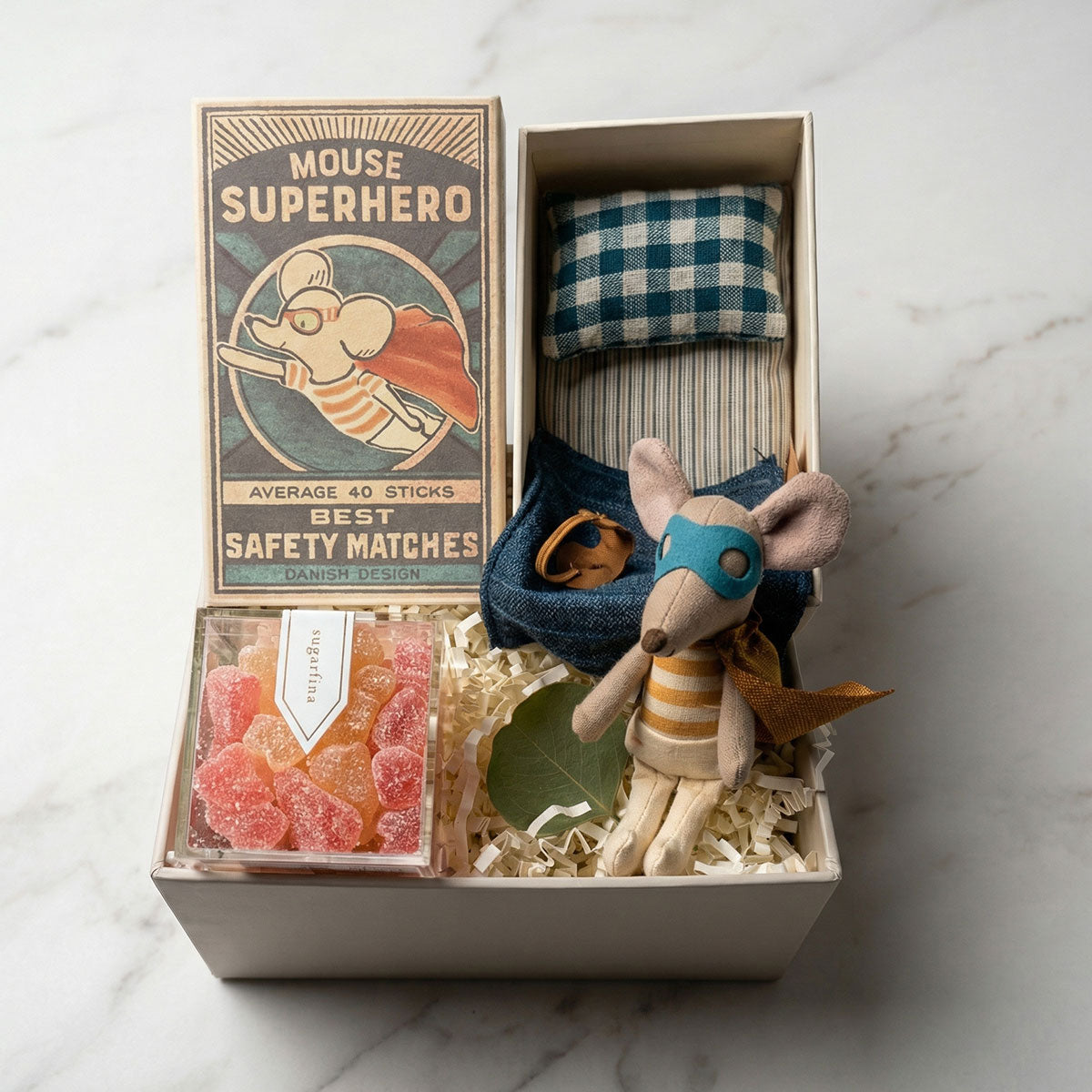 gift box with a Maileg Superhero Mouse in a matchbox, accompanied by a plush mouse, a gummy treat