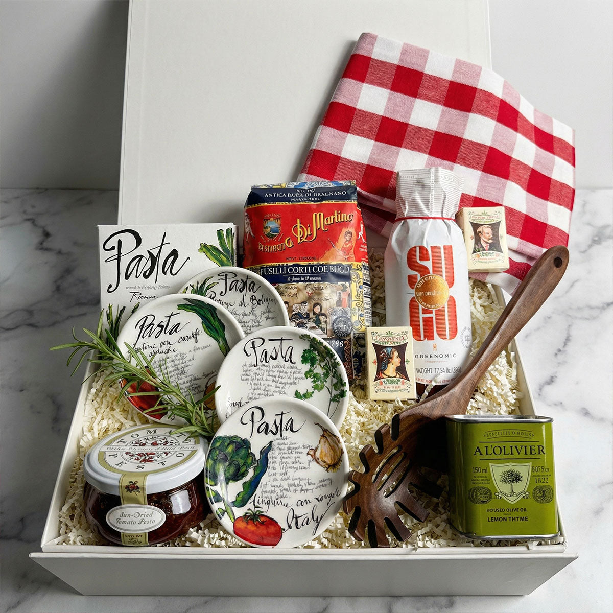 Trattoria Pasta Night Gift: Di Martino pasta tomato pesto, olive oil, wooden server, and dipping bowls.